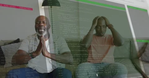 Two men on couch reacting to onscreen code overlay, adult rubbing head, senior Stock Footage 320955495