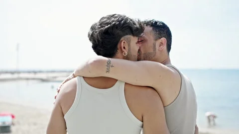 Two men couple hugging each other and ki... | Stock Video | Pond5