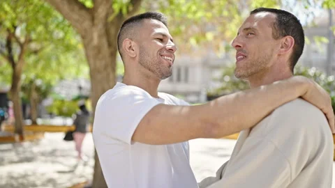Two men couple smiling confident hugging... | Stock Video | Pond5