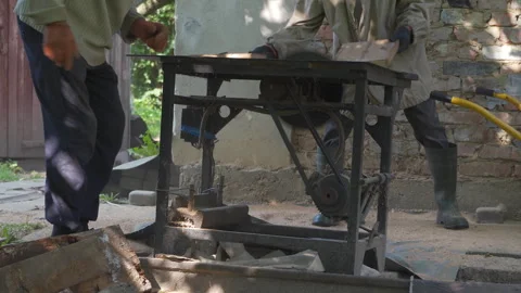 Two men cutting old boards on a circular saw Stock-Footage 312201432