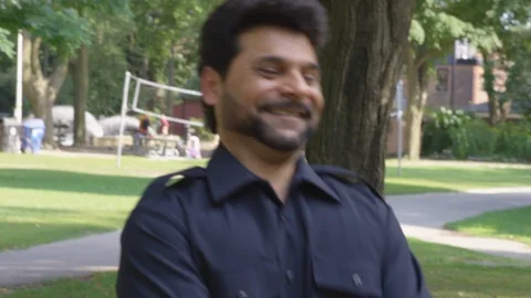 Two men dance around playfully with each other at the park - shot on RED Stock Footage 124718294