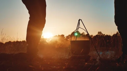 Two men dancing close-up at a camping party on nature fun funny silhouette of Stock Footage 88258290