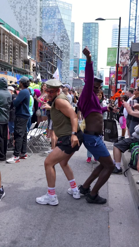Two Men Dancing Playfully at Pride Parade in Downtown Toronto Video stock 332018092