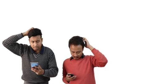 Two men with different ethnicities looking at their phone and confused and Stock Photos