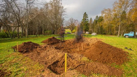 Two Men Digging Foundation Plot Timelapse Stock Footage 320422844