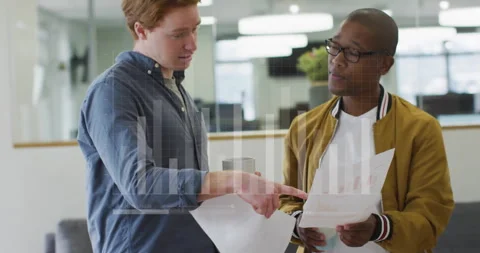 Two men discussing documents with financial data processing animation over them Stock Footage 304643450