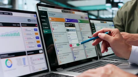 Two Men Discussing ERP Software Solutions On Laptops Stock Footage 346327957