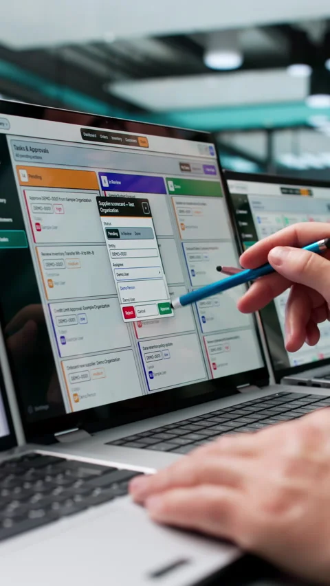 Two Men Discussing ERP Software Solutions On Laptops Stock Footage 347903795