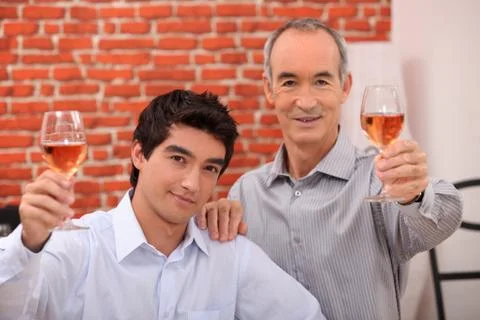 Two men drinking rose Stock Photos