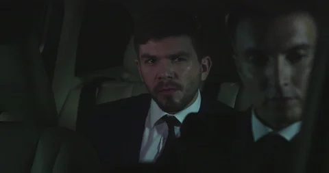 Two men drive in car at night. Stock Footage 119073286