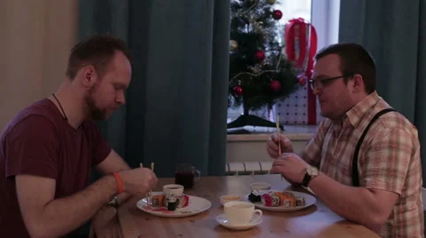 Two men eating sushi at the table Stock Footage 58865708