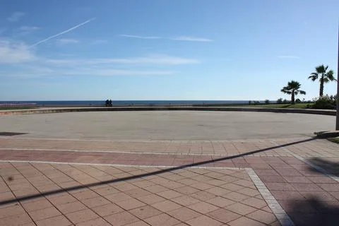 Two men on empty esplanade Stock Photos