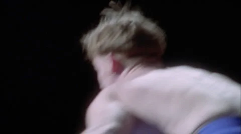 Two men engage in a wrestling match. Stock Footage