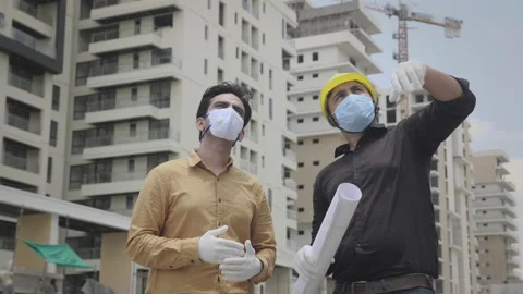 Two men engineers wearing face masks and hand gloves Stock Footage 135447634