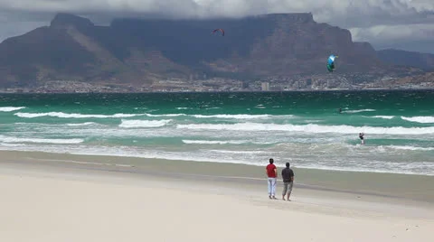Two Men Enjoying Table Mountain View from Cape Town Beach Video stock 23753279