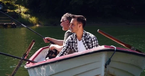 Two men enjoying the view while fishing  Stock-Footage 79680318