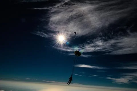 Two men enjoys sky diving. Stock Photos