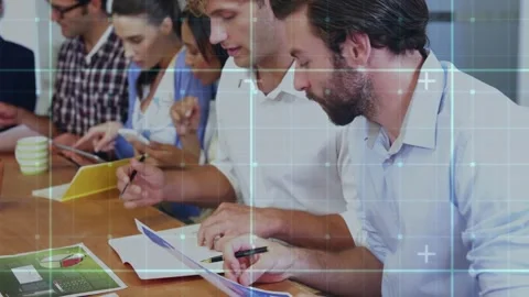 Two men examining sheets, leaning in and annotating in business meeting while Stock Footage 328396487