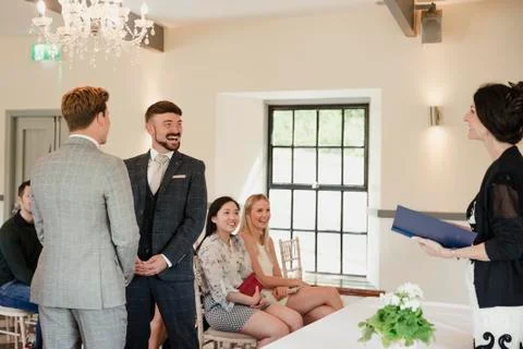 Two Men Exchanging Vows On Their Wedding Day Photos