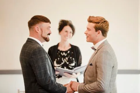 Two Men Exchanging Vows On Their Wedding Day Stock Photos