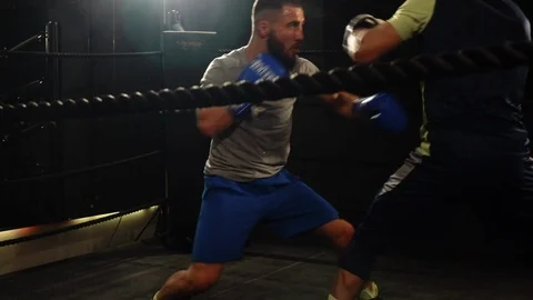Two men exercising inside a box ring in slow motion 스톡 동영상 101211637