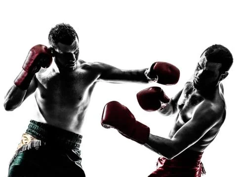 Two men exercising thai boxing silhouette Stock Photos