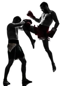 Two men exercising thai boxing silhouette Stock Photos