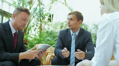 Two men explain to the colleague the idea Stock Footage 57457470