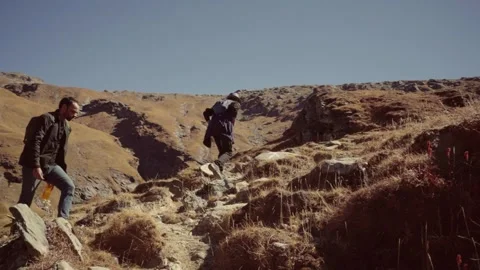 Two men exploring landscape in a Bhrigu lake, Manali, Himachal Pradesh, India Stock Footage 333112779