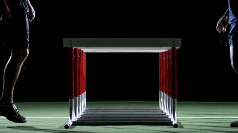 Two men face to face side step over hurdles in a gym. Stock Footage 33834185