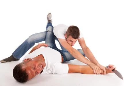 Two men fighting for a knife Stock Photos