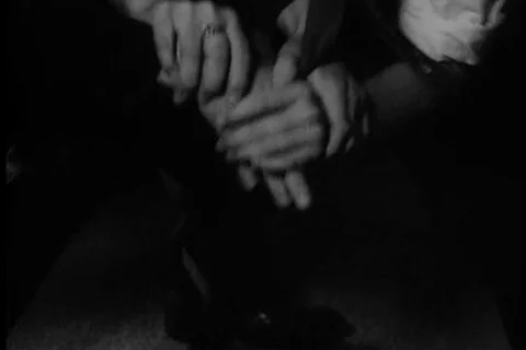 Two men fighting over handgun and dropping it on floor, 1960s Stock Footage 90727735