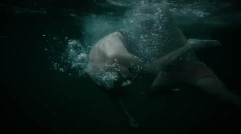 Two men fighting under the water Stock Footage 62510360