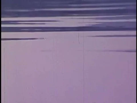 Two men fish from a motorboat in a river In Oklahoma's green county in 1970, Stock-Footage 74948567