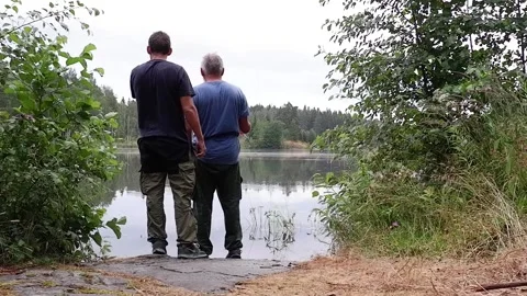 Two men fishing in the river. Stock Footage 235886277