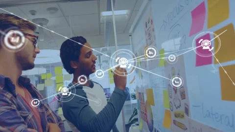 Two men gesturing, writing on glass board for design, animated nodes linking Stock Footage 332981366
