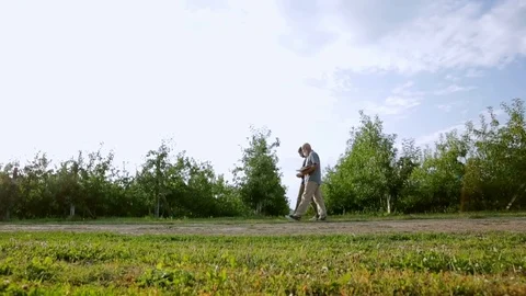 Two men go to orchards Stock Footage 78154034
