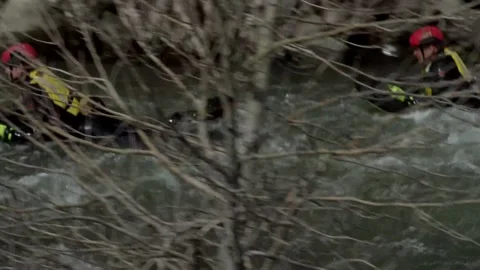 Two Men Going Down River on Flat Raft Board Stock Footage 130358612