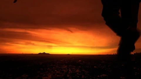 Two men going into the sunset, mountains Stock Footage 102613905