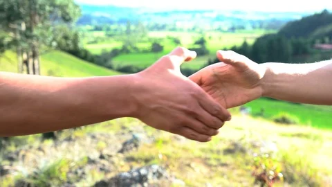 Two men greet each other with their hands. Stock Footage 117331936