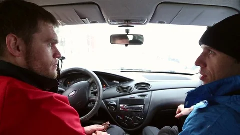 Two men greet inside the car Stock Footage 72693030