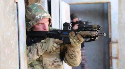 Two men guarding doorways during antiterrorism training Stock Footage 58181726