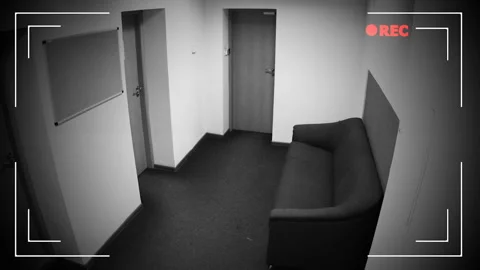 Two men with guns breaking in apartment, shooting in surveillance camera, crime Stock Footage 99007590