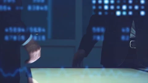 The two men handshake near a display on the hologram background. slow motion Video stock 100460280