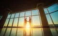 The two men handshake in the office on the bright sun background Photo