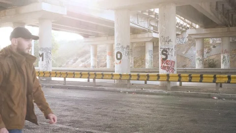 Two men have fight under bridge Stock Footage 118402886
