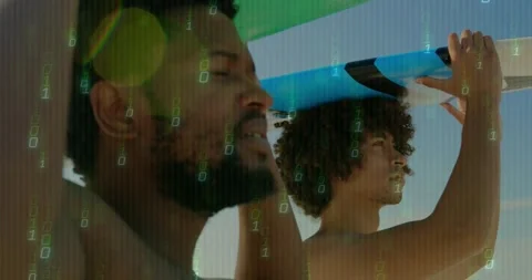Two men holding surfboard on beach, camera pan causing binary overlay as men Stock Footage 331756555