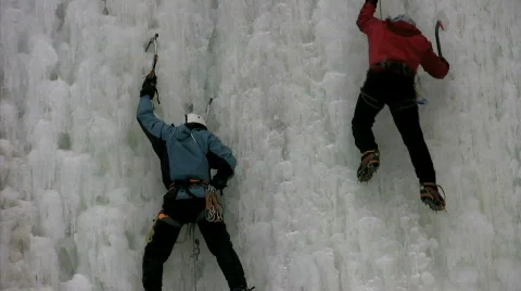 Two men ice climbing Stock Footage 313685