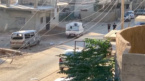 Two Men Jog Through on an Arab Street co Stock Footage 120940526