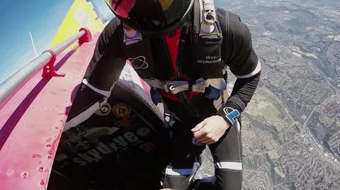 Two men jumping with a parachute over California Stock Footage 66538708